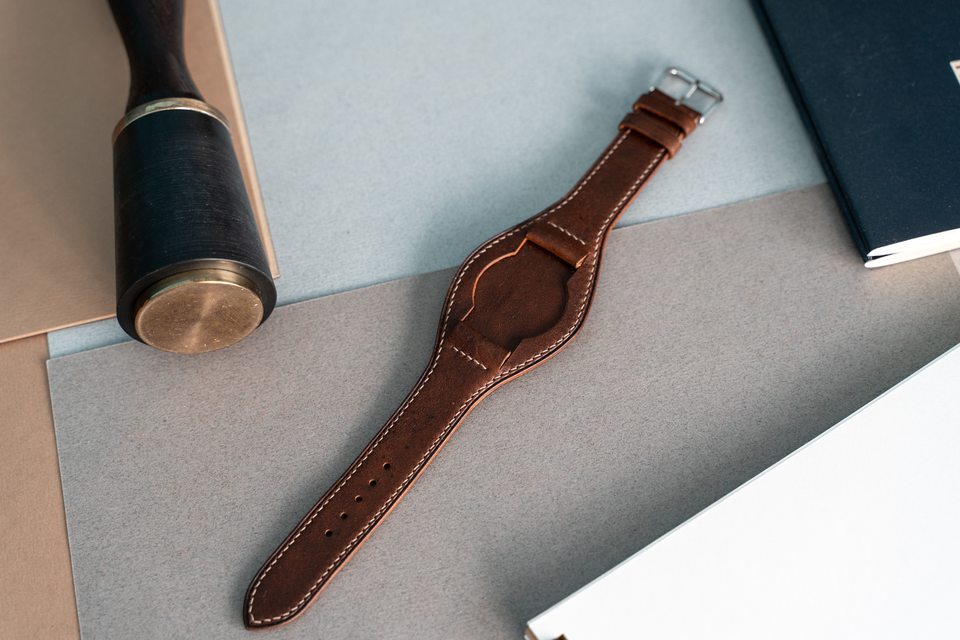 Cognac Bund strap with the watch removed, showing the shaped centre.