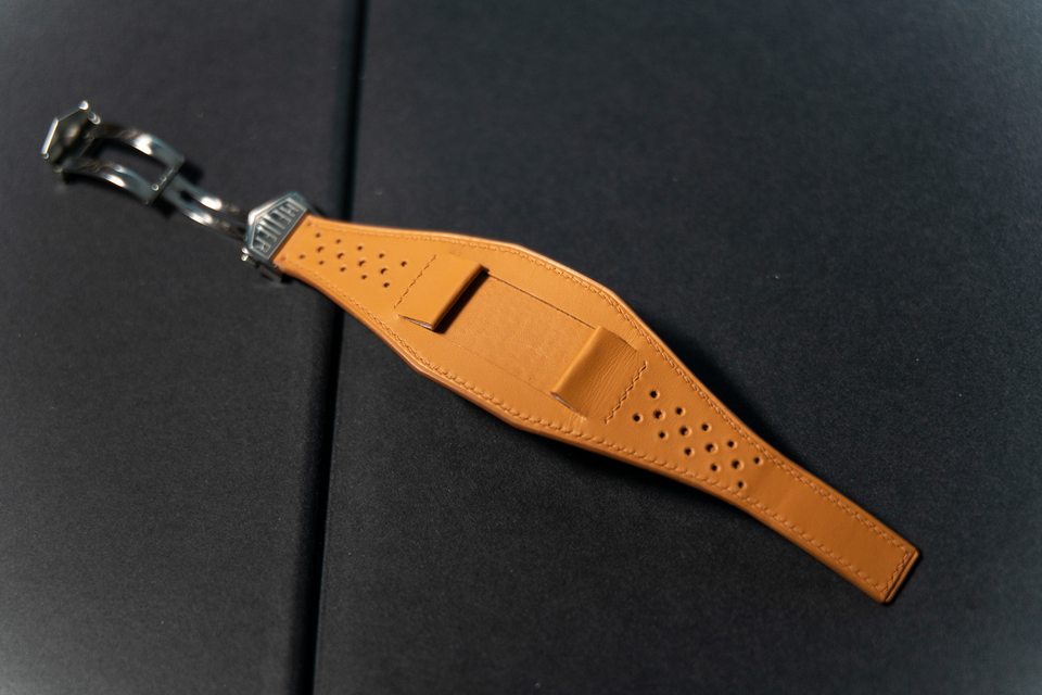 Perforated tan Bund design opened flat to show the pad and its attachments.