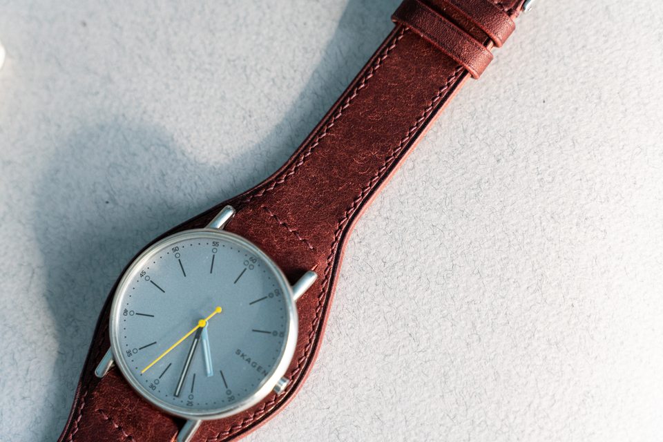 Red Bund strap seen diagonally from the fitted watch towards the buckle end.
