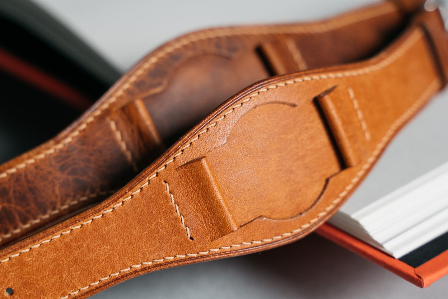 A close view of a brown leather strap