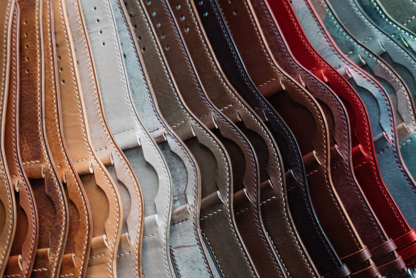 A row of straps in different leathers