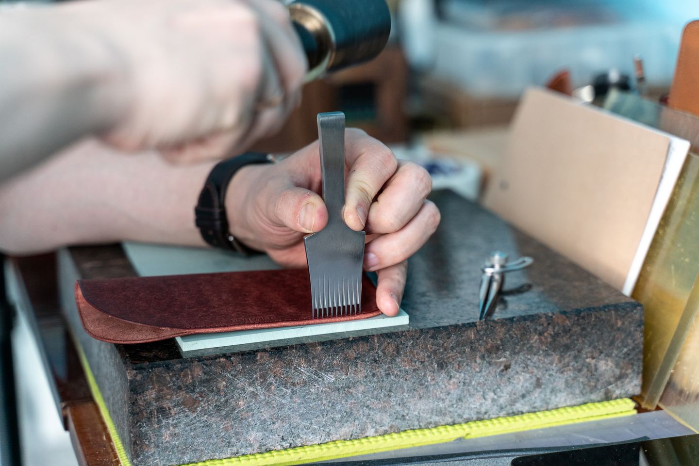 Thinning the leather by hand at the bench