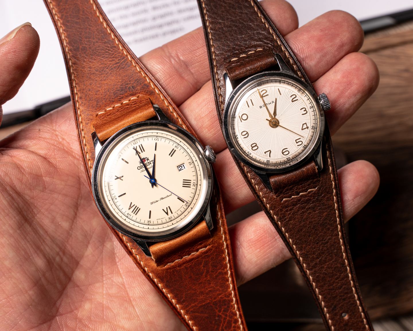 Two watches on bund straps, fitted and held